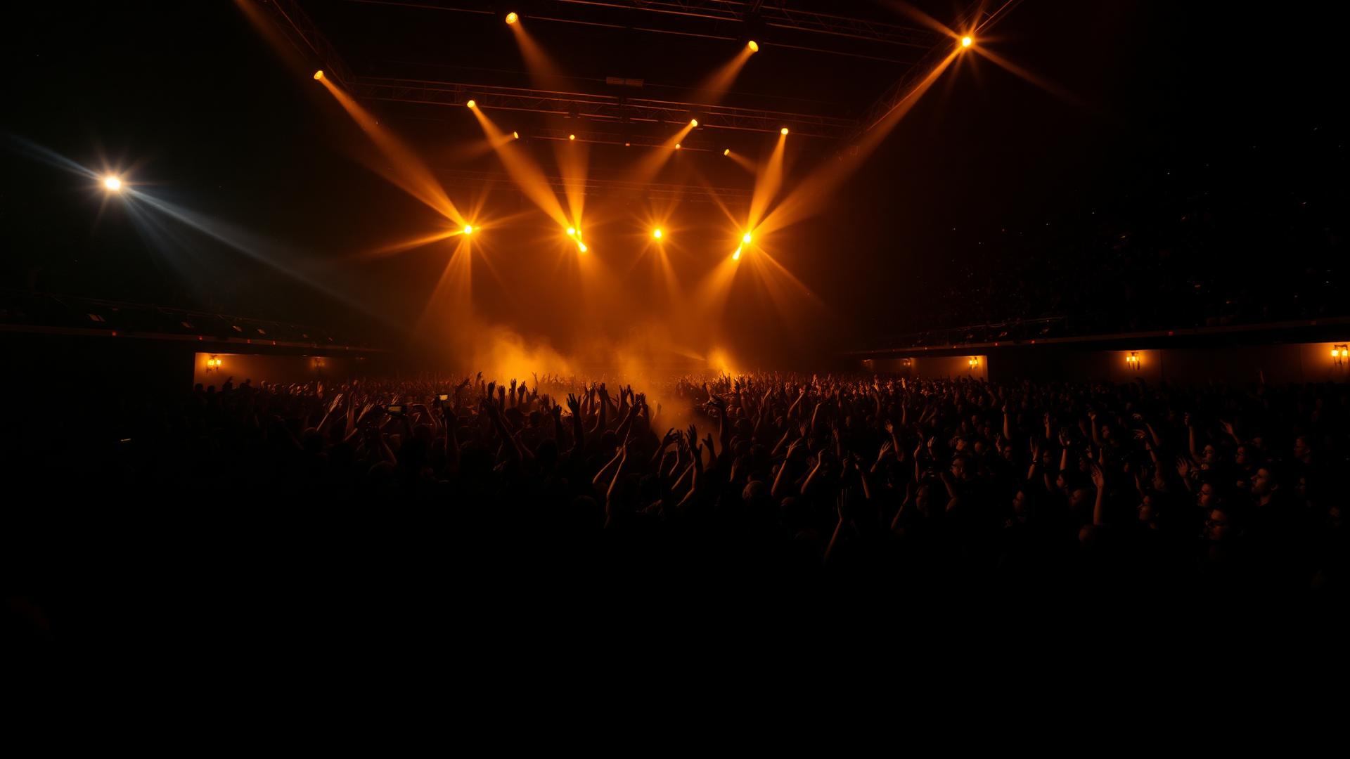Cinematic concert crowd under stage lighting